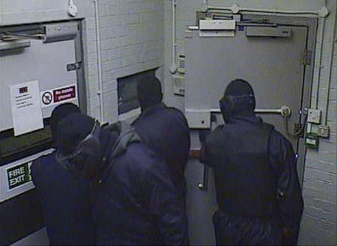 1.29am Four masked men in the lobby area