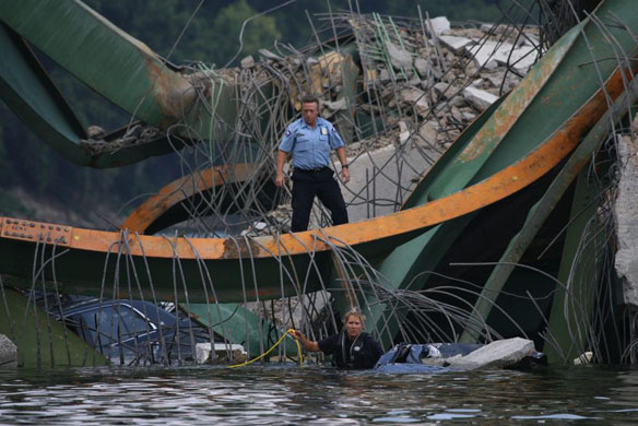 A rescue worker prepares to search a submerged vehicle