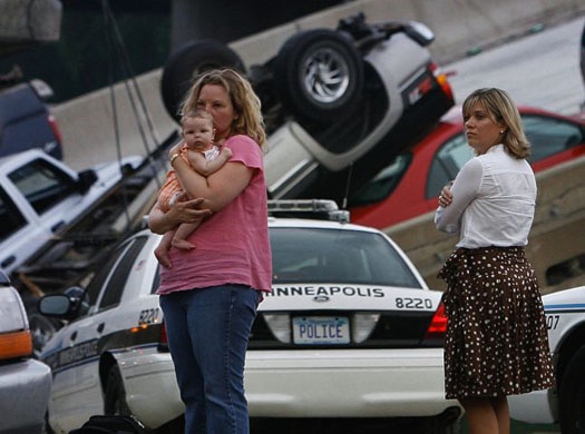 Melissa Hughes holds an unidentified infant
