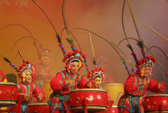 Drummers perform on stage