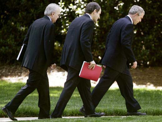 President Bush walks back to the Oval Office with Karl Rove and economic adviser Al Hubbard