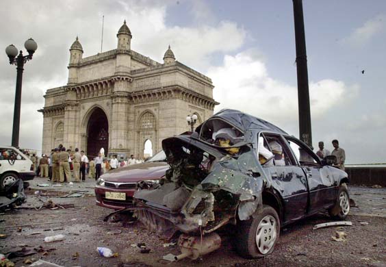  damaged in a bomb blast lies next to the Gateway of India in Mumbai ...