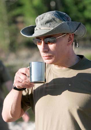 Putin drinks tea while fishing with Prince Albert II