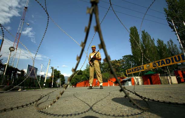 Soldier behind barbed wire