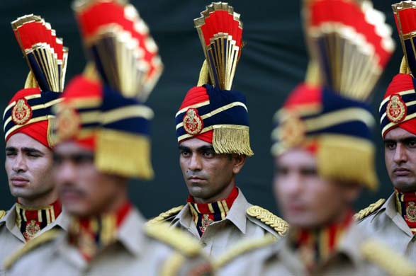 Officers of the Delhi police force stand to attention