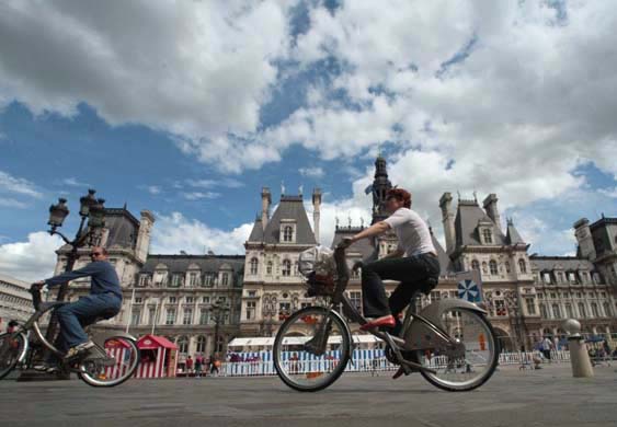 People ride 'Velib' bicycles