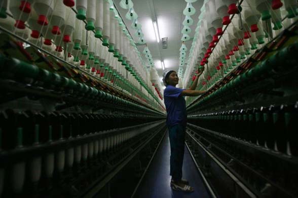 A worker on the production line of a textile factory