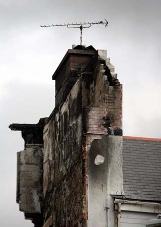 Smoke still rises from the rubble at the site of the Penhallow Hotel