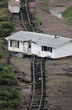 A house rests on railway tracks