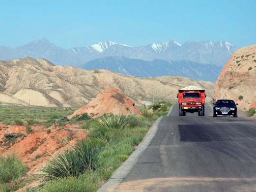 A mining truck carrying another load of ore through Gansu