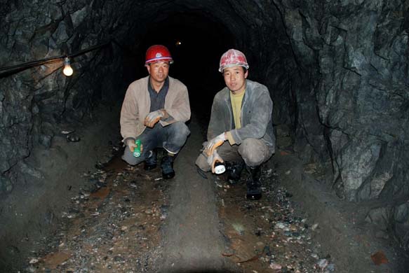 Workers inside the flourite mine in Gansu, China