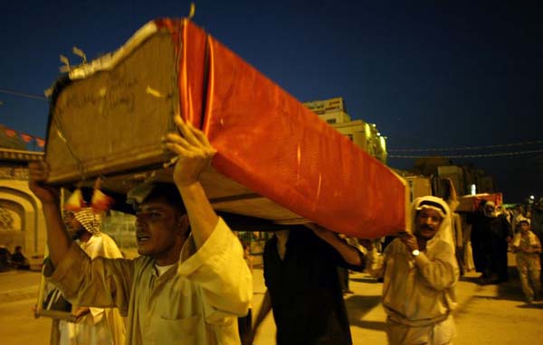 Coffins are carried to the Imman Ali shrine