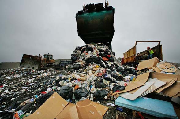 A truck empties its load of waste at Shelford Landfill
