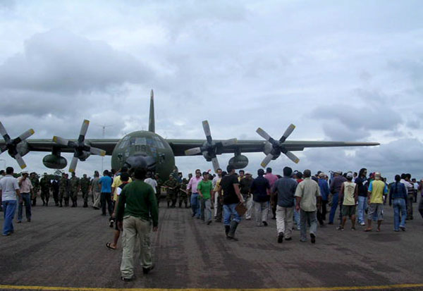 Riberelta, Bolivia: Residents surround a Venezuelan Hercules plane