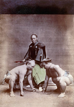 A portrait of two sumo wrestlers