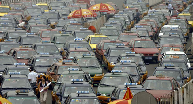 Taxis queue up outside the railway station