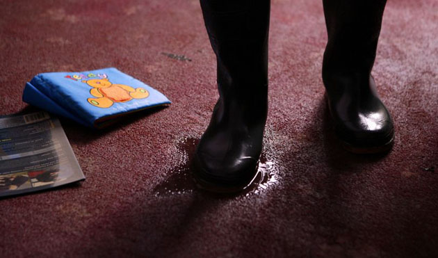 A homeowner returns after the flash floods