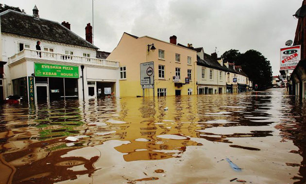 A local resident looks out on Evesham High Street