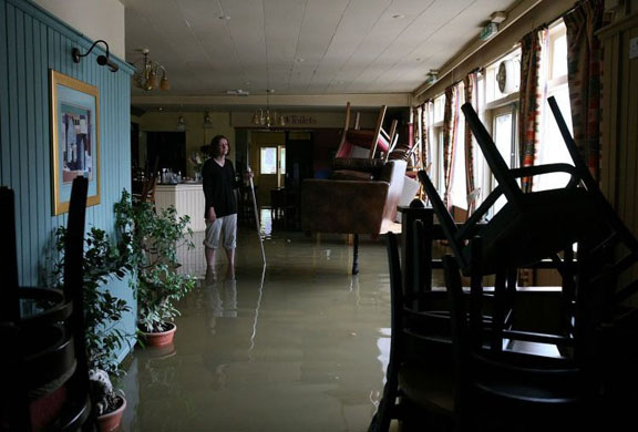 Amanda Green, landlady of the flooded Canterbury Arms in Tewkesbury, surveys the damage