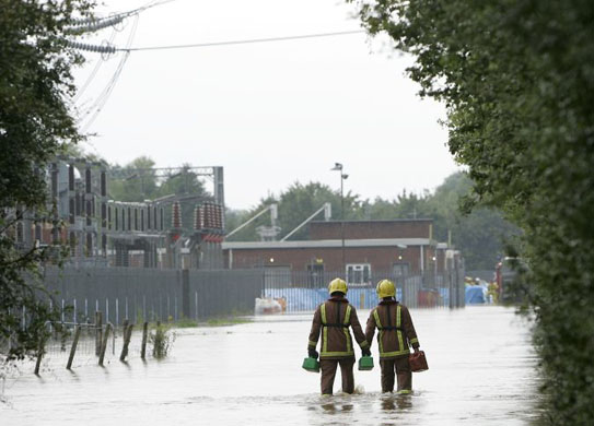 Firefighters working at Walham power station