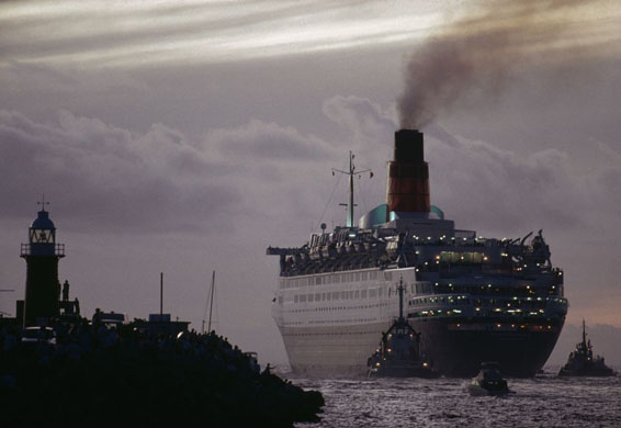 The cruise ship QE2 steams out of Fremantle harbour, Australia