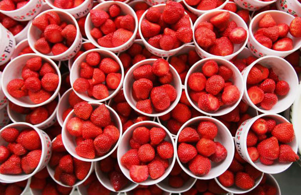 Strawberries are prepared during day three of the Wimbledon Lawn Tennis Championships
