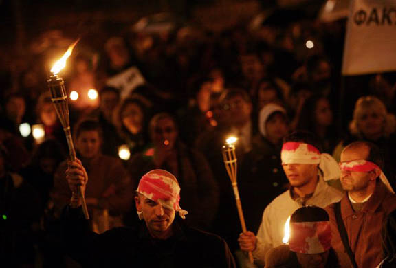 Science teachers and students take part in a torchlight procession to protest against the national budget for the 2008
