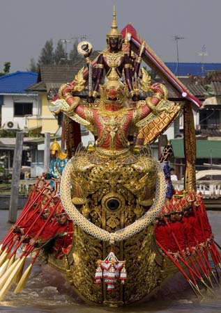 An ancient warrior boat on procession on the river Phraya in Thailand