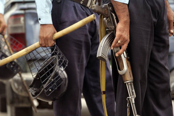 Police stand outside the presidential palace in Islamabad