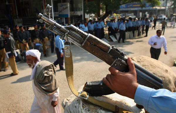 Police officers prepare to block lawyers from marching to the supreme court in protest against emergency rule