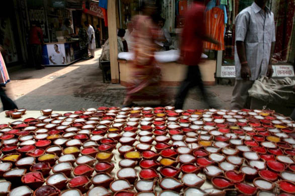 Lamps are for sale at a sidewalk during the Diwali festival