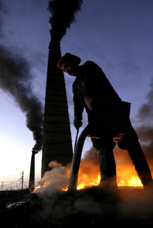 A man works in a brick factory