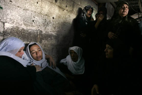 Relatives of Ibrahim Ahmed, 13, during his funeral