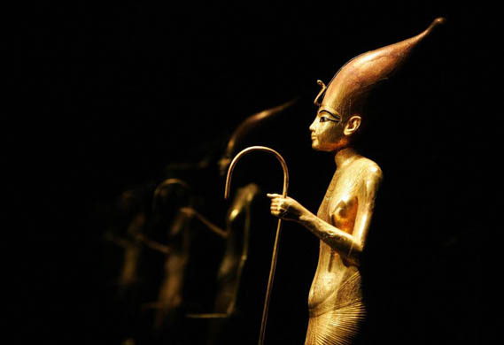 A statuette of the king wearing the tall crown from upper Egypt at the exhibition 'Tutankhamun and the Golden Age of the Pharaohs'