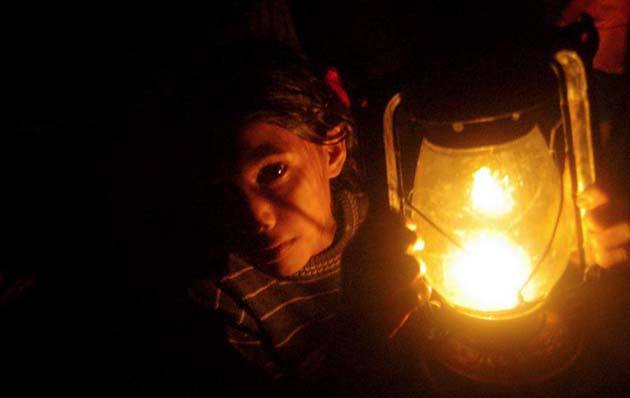 A girl lights her way at shelter