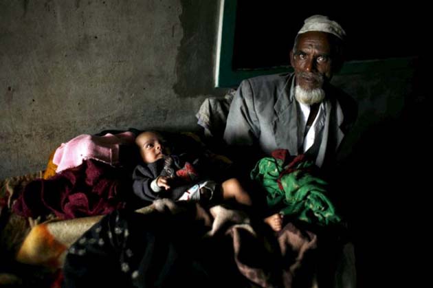 A Bangladeshi man takes shelter 