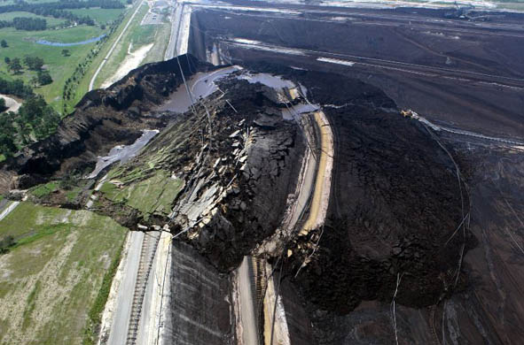 A view of a Yallourn coal mine which collapsed, washing away a road as well as rail lines