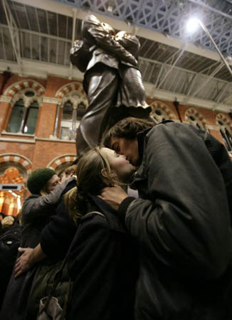 Crowds take part in 'Flash Snog', a flash-mob event at St Pancreas station