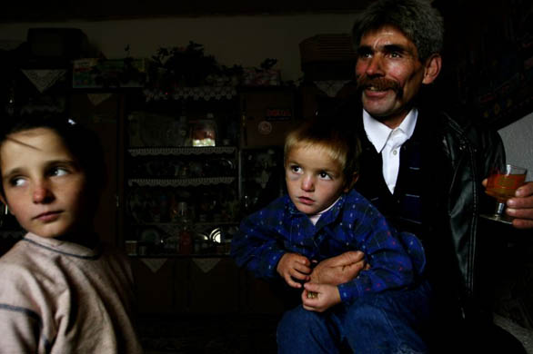 Ethnic Albanian Hasan Bajgora with his son, Clinton Bajgora who is named after former US president Bill Clinton