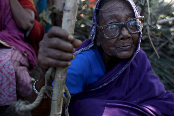 A woman waits in a queue for releif