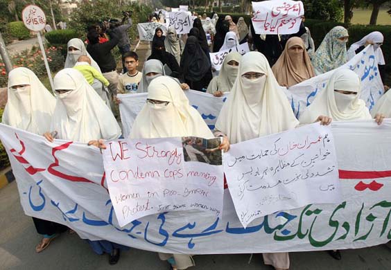 Women in Burkas protest