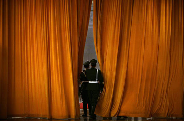 Guards of honour open a curtain just before the welcoming ceremony for Ecuadorian president Rafael Correa