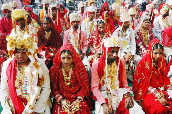 Brides and grooms during a mass marriage ceremony