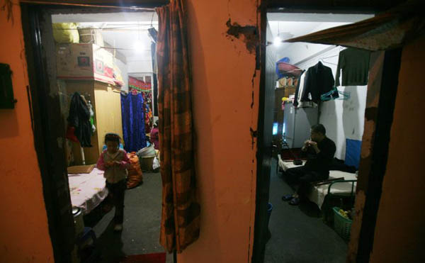 Residents relax in their rooms at the Yangguang Apartments