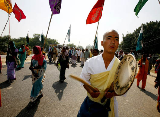 A Buddhist monk leads the Janadesh rally