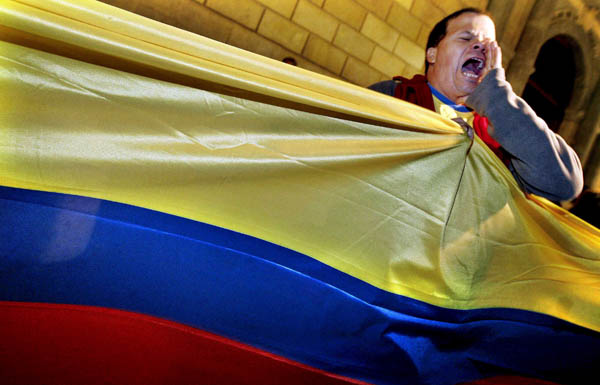 A man shouts slogans during a demonstration against racism