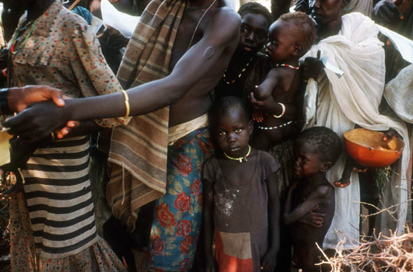 Famine victims wait in line for food distribution at a World Vision feeding centre
