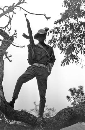  A guerilla soldier stands guard