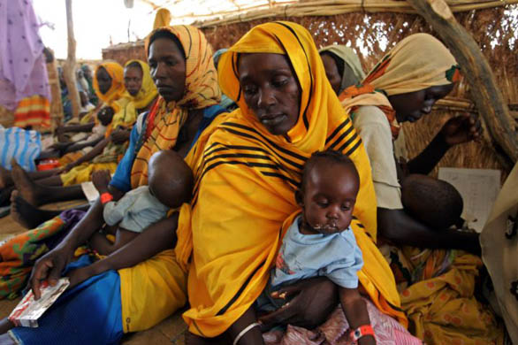 Malnourished children are fed at the Medecins Sans Frontiers nutrition centre in the Mornay camp