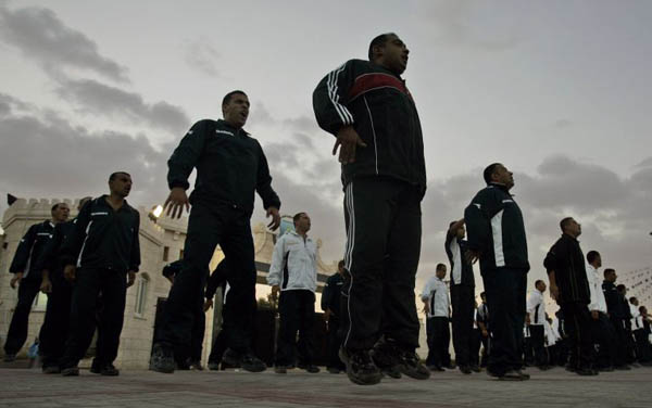 Young Palestinian cadets participates in a morning drill